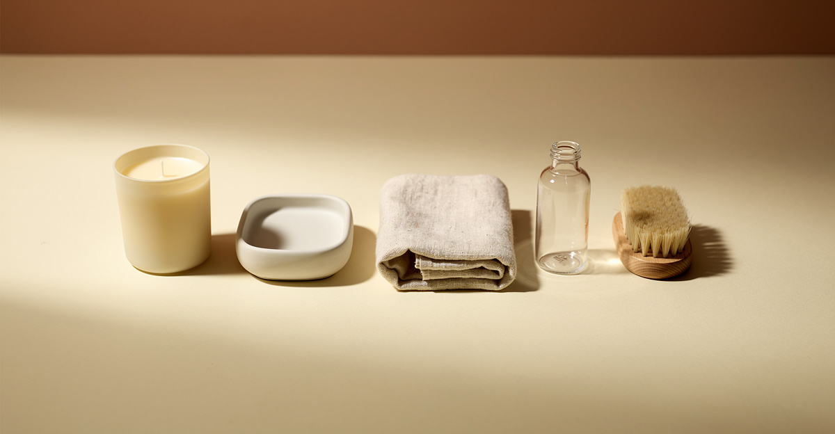 Five small unbranded products in a row on a warm cream surface, representing product category selection